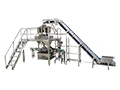 Machine d'emballage avec peseuse associative