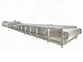 Pasteurisateur à bain-marie avec convoyeur à rouleaux